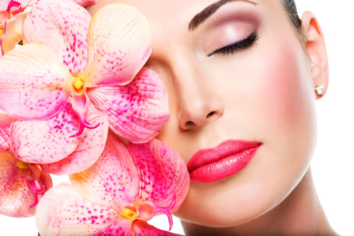 Relaxed beautiful face of a young girl with clear skin and pink